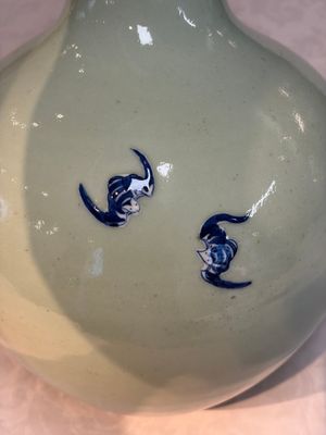 A Chinese blue and white celadon-ground 'Sanxing' bottle vase with relief design, 19th C. — photo 6