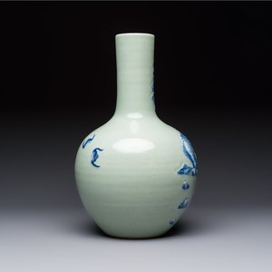 A Chinese blue and white celadon-ground 'Sanxing' bottle vase with relief design, 19th C. — photo 4
