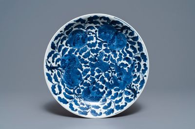 A Chinese blue and white charger with sanduo fruits among foliage, Kangxi