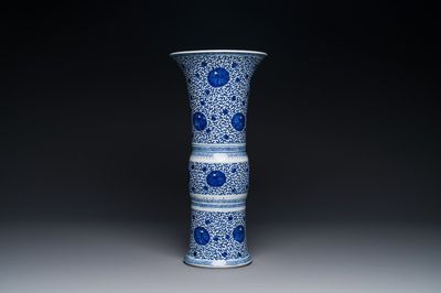 A Chinese blue and white 'chrysanthemum scroll' 'gu' vase, Kangxi
