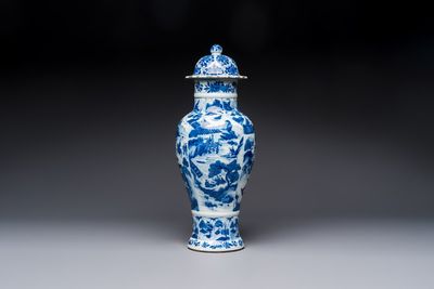 A Chinese blue and white covered vase with figures in landscapes, Kangxi