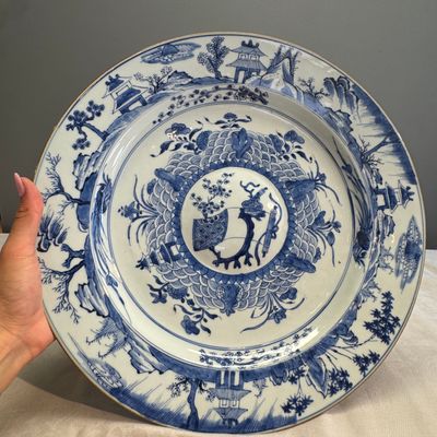 A Chinese blue and white dish with a raised medallion centre — photo 1
