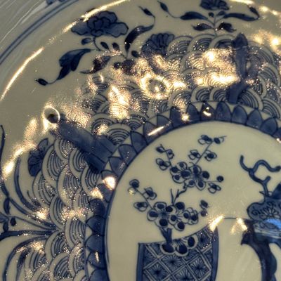 A Chinese blue and white dish with a raised medallion centre — photo 8