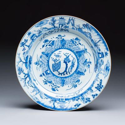 A Chinese blue and white dish with a raised medallion centre, Yongzheng