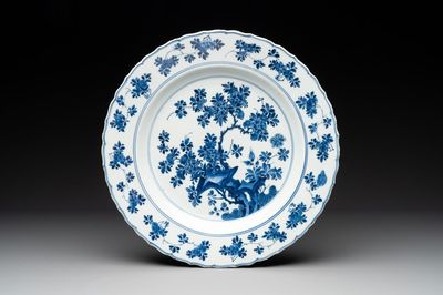 A Chinese blue and white dish with floral design, Kangxi mark and of the period