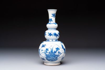 A Chinese blue and white double gourd 'Antiquities' vase, Kangxi