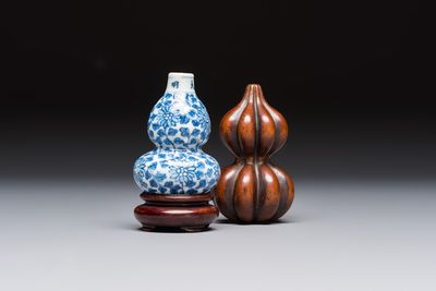 A Chinese blue and white double-gourd snuff bottle and a huali snuff bottle, Xuande and Qianlong mark, 19th C.
