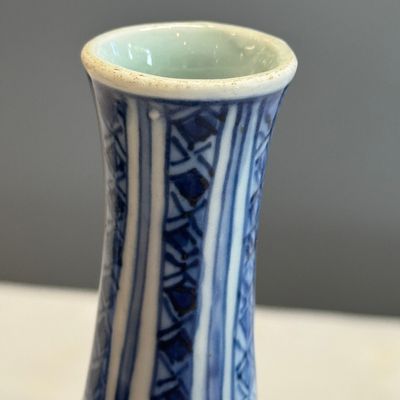 A Chinese blue and white double-gourd vase with floral design — photo 10