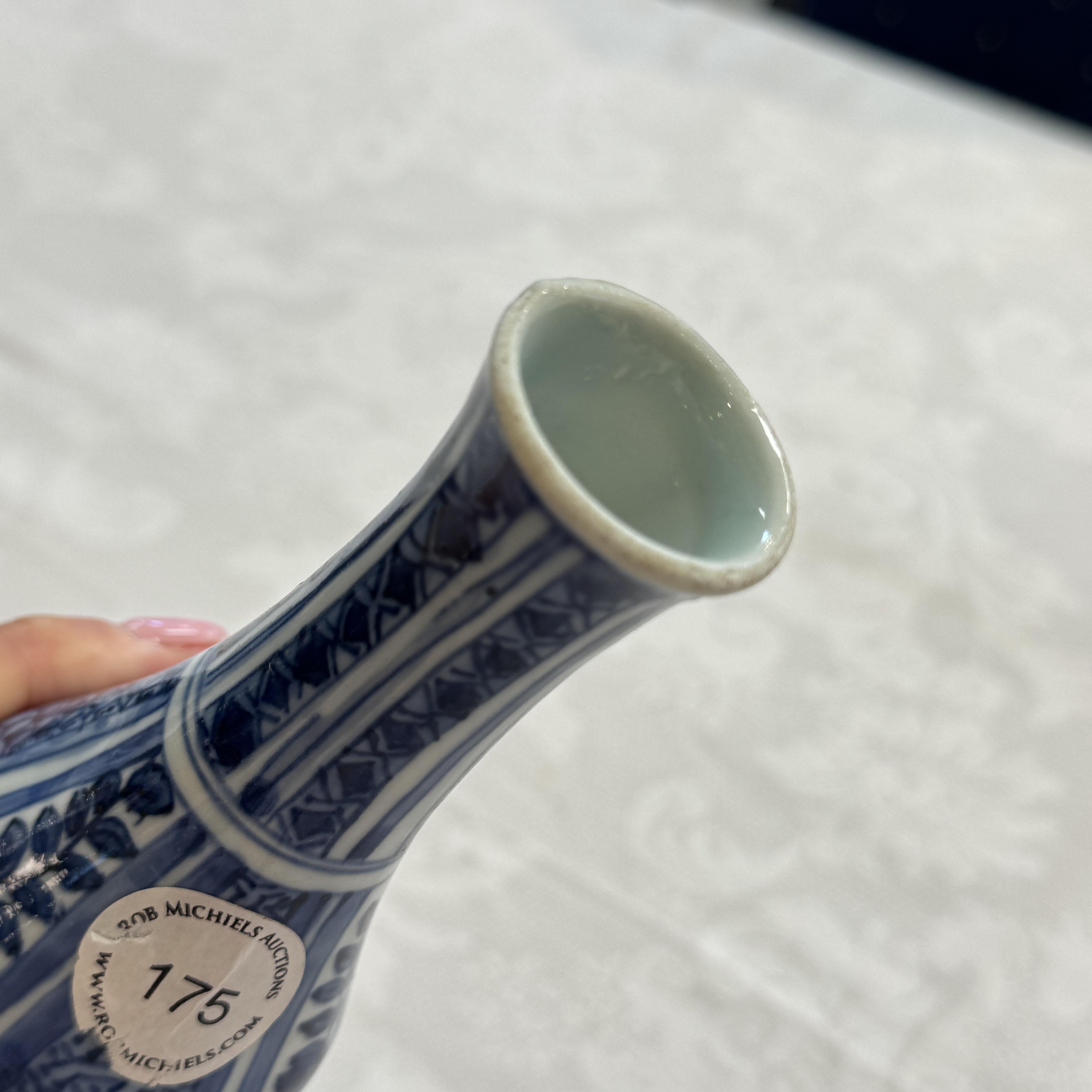 A Chinese blue and white double-gourd vase with floral design — photo 23