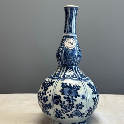 A Chinese blue and white double-gourd vase with floral design — photo 1