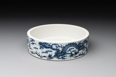 A Chinese blue and white 'dragon and phoenix' brush washer, Yongzheng mark, 19th C.
