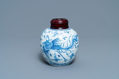 A Chinese blue and white 'dragon and phoenix' jar with wooden lid, Chenghua mark, Kangxi