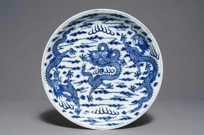 A Chinese blue and white 'dragon' dish, Kangxi mark, 19th C.