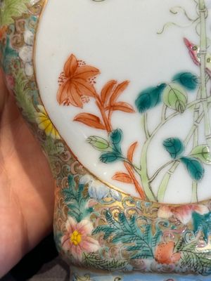 A Chinese blue and white 'dragon' vase, a famille rose 'millefleurs' vase and a teapot, Qianlong mark, 19/20th C. — photo 17