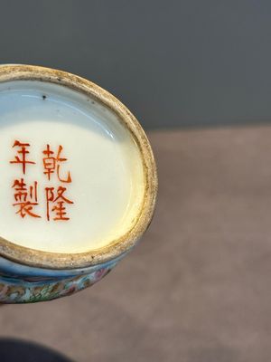 A Chinese blue and white 'dragon' vase, a famille rose 'millefleurs' vase and a teapot, Qianlong mark, 19/20th C. — photo 32