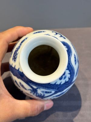 A Chinese blue and white 'dragon' vase, a famille rose 'millefleurs' vase and a teapot, Qianlong mark, 19/20th C. — photo 6