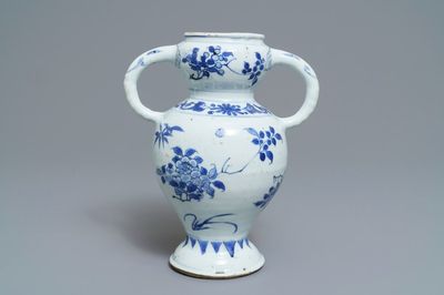A Chinese blue and white elephant-handled vase with floral design, Transitional period