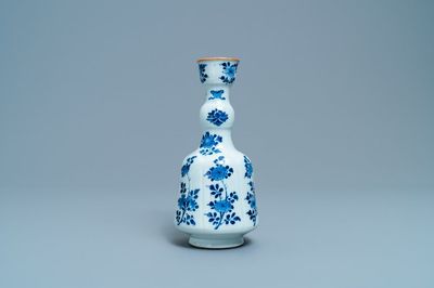 A Chinese blue and white elongated huqqa base with floral design, Kangxi