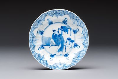 A Chinese blue and white 'Erotic Subject' saucer, Chenghua mark, Kangxi