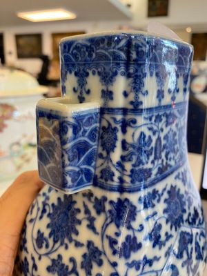 A Chinese blue and white 'fanghu' vase with lotus scrolls, Qianlong mark, 19/20th C. — photo 12