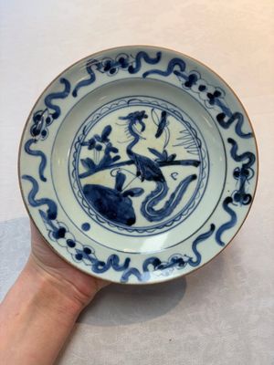 A Chinese blue and white 'floral' dish and a 'phoenix' plate, Ming — photo 1