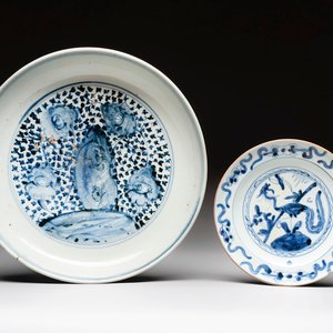 A Chinese blue and white 'floral' dish and a 'phoenix' plate, Ming — photo 1