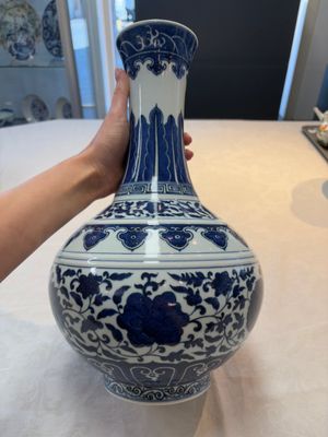 A Chinese blue and white 'flower scroll' bottle vase, Xuantong mark, 20th C. — photo 2