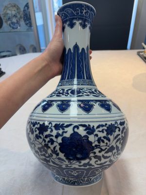 A Chinese blue and white 'flower scroll' bottle vase, Xuantong mark, 20th C. — photo 4
