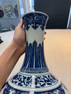 A Chinese blue and white 'flower scroll' bottle vase, Xuantong mark, 20th C. — photo 8