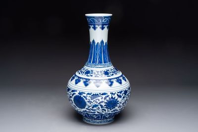 A Chinese blue and white 'flower scroll' bottle vase, Xuantong mark, 20th C.