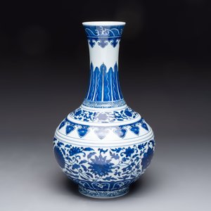 A Chinese blue and white 'flower scroll' bottle vase, Xuantong mark, 20th C. — photo 2