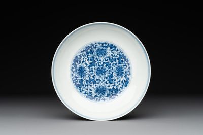 A Chinese blue and white 'flower scroll' plate, Yongzheng mark and of the period