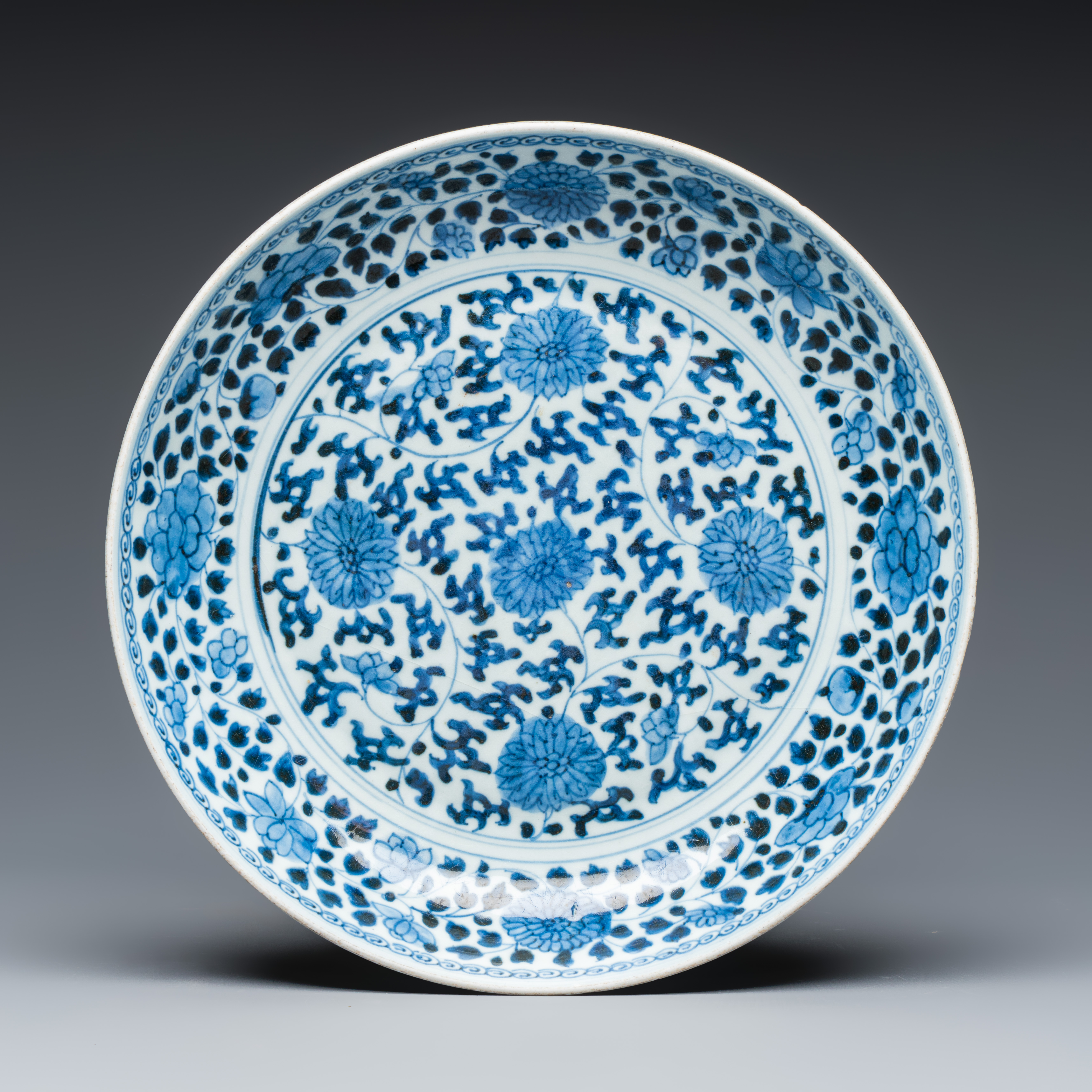A Chinese blue and white 'Flower Scrolls' dish, Yongzheng