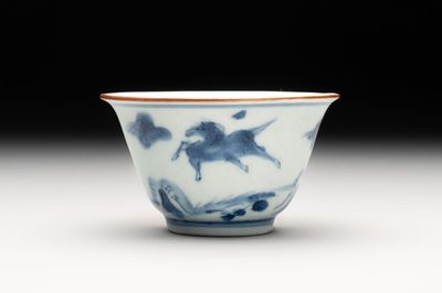 A Chinese blue and white 'flying horses' cup, Da Qing Bing Wu Nian Zhi 大清丙午年製 mark, dated 1666