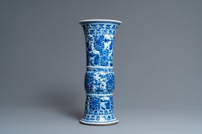 A Chinese blue and white 'gu' vase with floral and lanscape panels, Kangxi