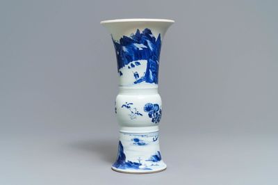 A Chinese blue and white 'gu' vase with landscape design, Kangxi mark and of the period