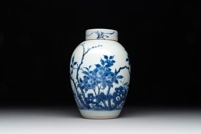 A Chinese blue and white jar and cover with birds among flowering branches, Transitional period