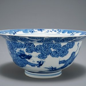 A Chinese blue and white klapmuts bowl with a tiger fighting a dragon, Chenghua mark, Kangxi — photo 1