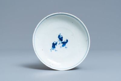 A Chinese blue and white ko-sometsuke plate with three playing boys for the Japanese market, Transitional period