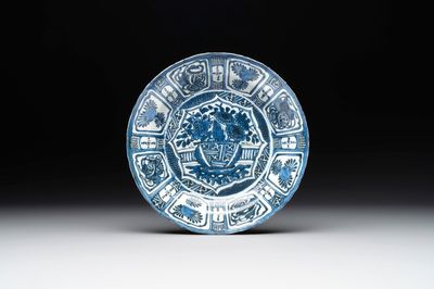 A Chinese blue and white kraak porcelain dish with flowers in a jardiniere, Wanli