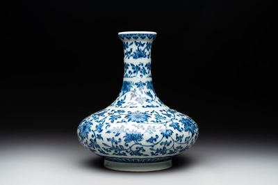 A Chinese blue and white 'lotus scroll' bottle vase, 18/19th C.