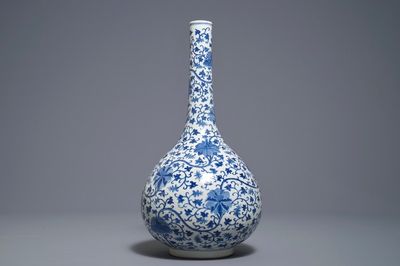 A Chinese blue and white 'lotus scroll' bottle vase, 18/19th C.
