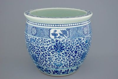 A Chinese blue and white lotus scroll fish bowl, 19th C.