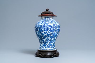 A Chinese blue and white 'lotus scroll' vase, 19th C.