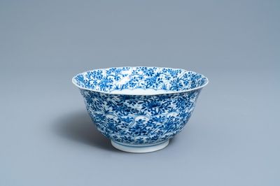 A Chinese blue and white molded bowl with floral design, Kangxi