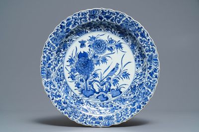 A Chinese blue and white moulded dish with a bird among flowers, Kangxi
