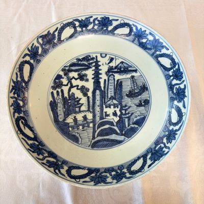 A Chinese blue and white 'Mountainous Landscape' dish — photo 1