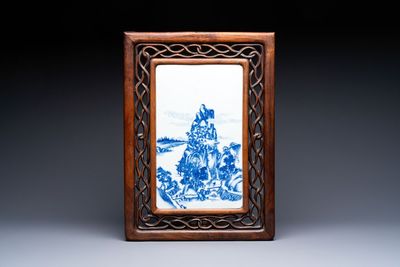 A Chinese blue and white 'mountainous landscape' plaque mounted in a wooden frame, 19/20th C.