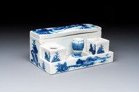 A Chinese blue and white 'Mountainous Landscape' writing set with an inkwell, sander and candlestick, Qianlong