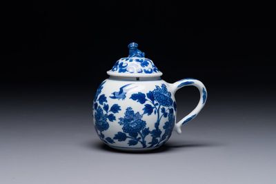 A Chinese blue and white mustard jar and cover with floral design, Kangxi
